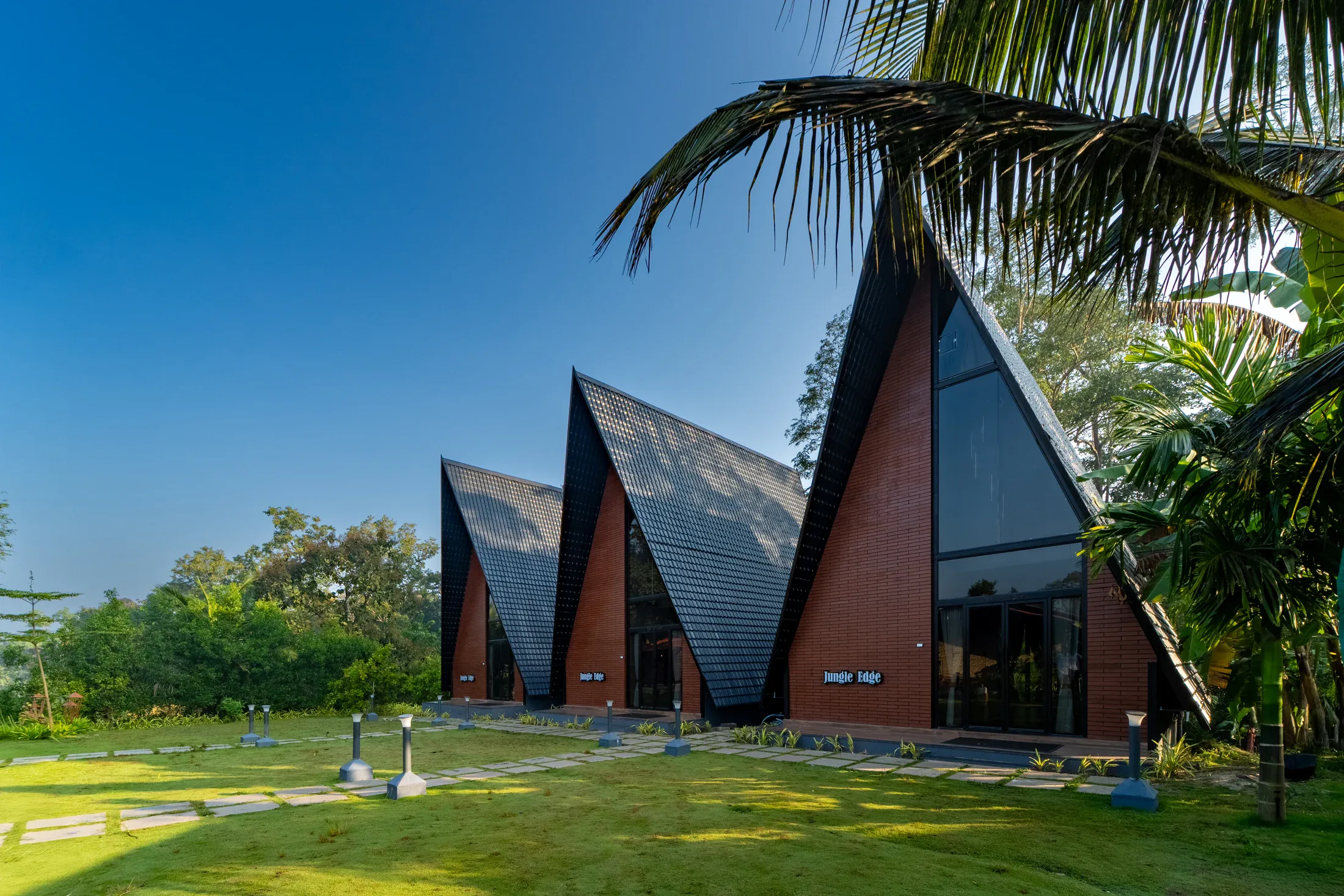 The real A-frame cottages and gardens at Jungle Edge